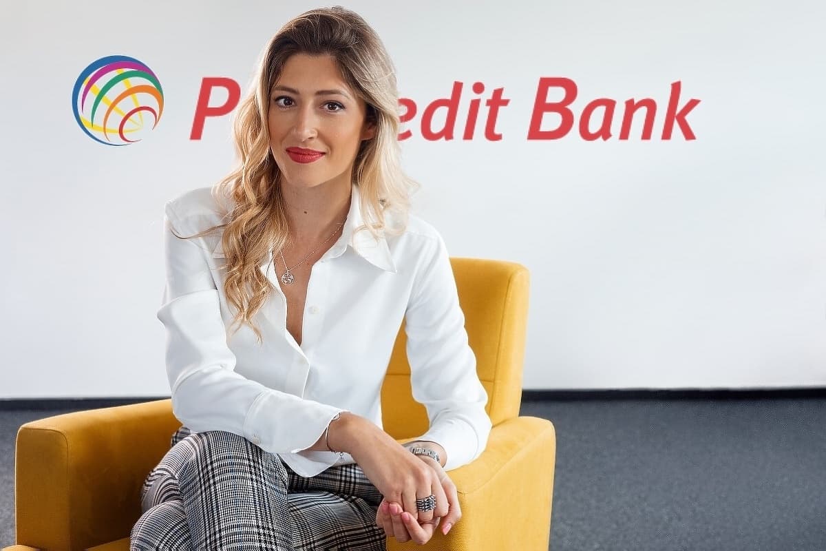 Amina Durmo Trlin, Board Chairman of ProCredit Bank, seated in front of the bank's logo